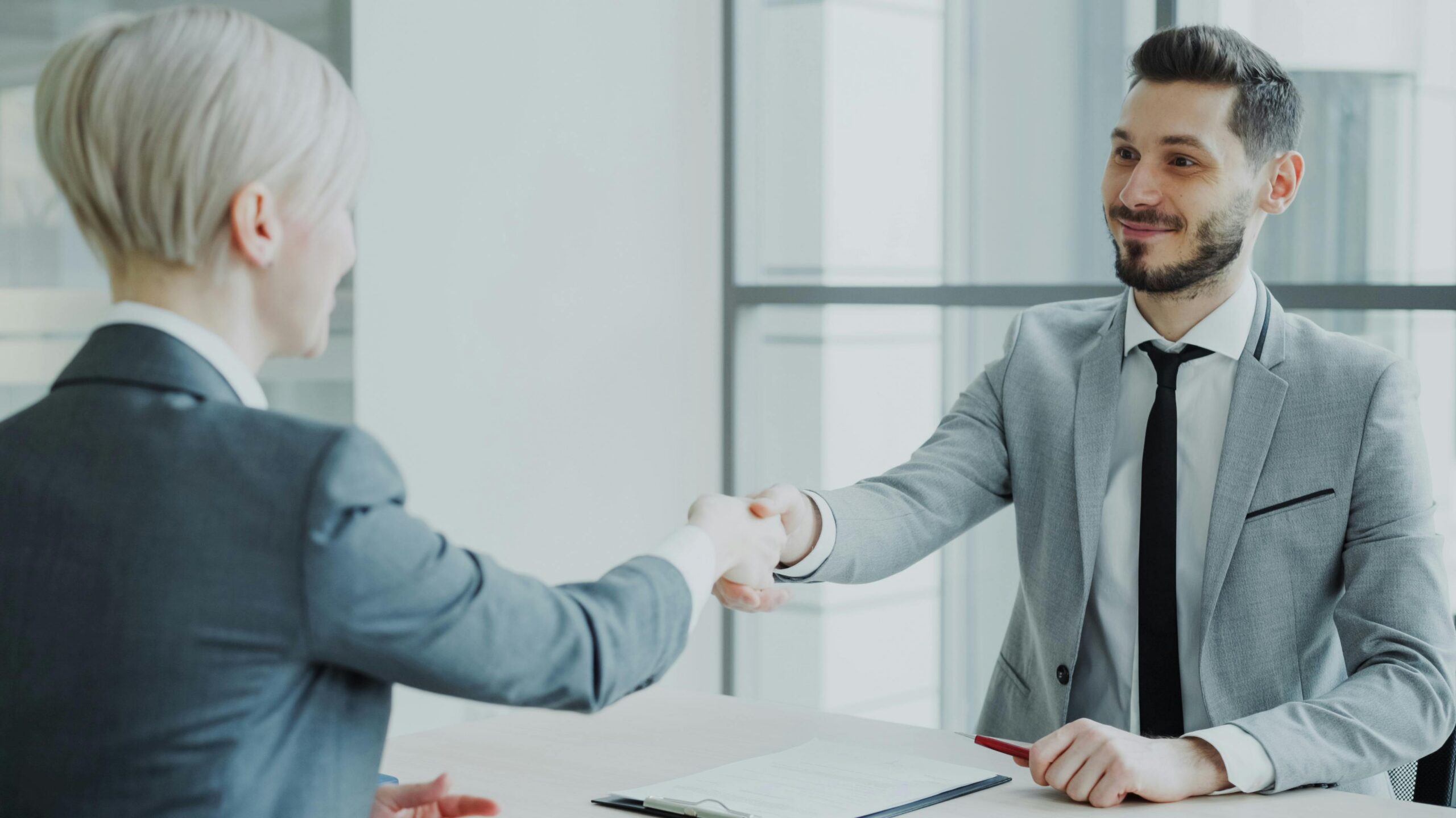 Two people shaking hands.